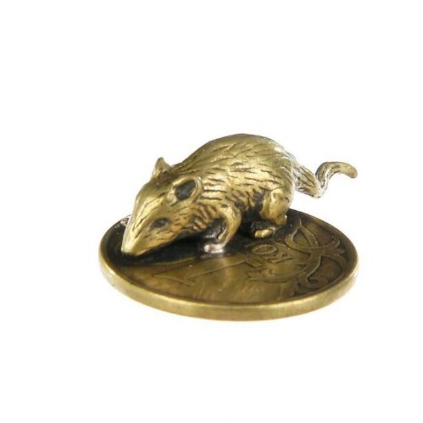 Amulet of a mouse in a purse with a coin for luck in money matters