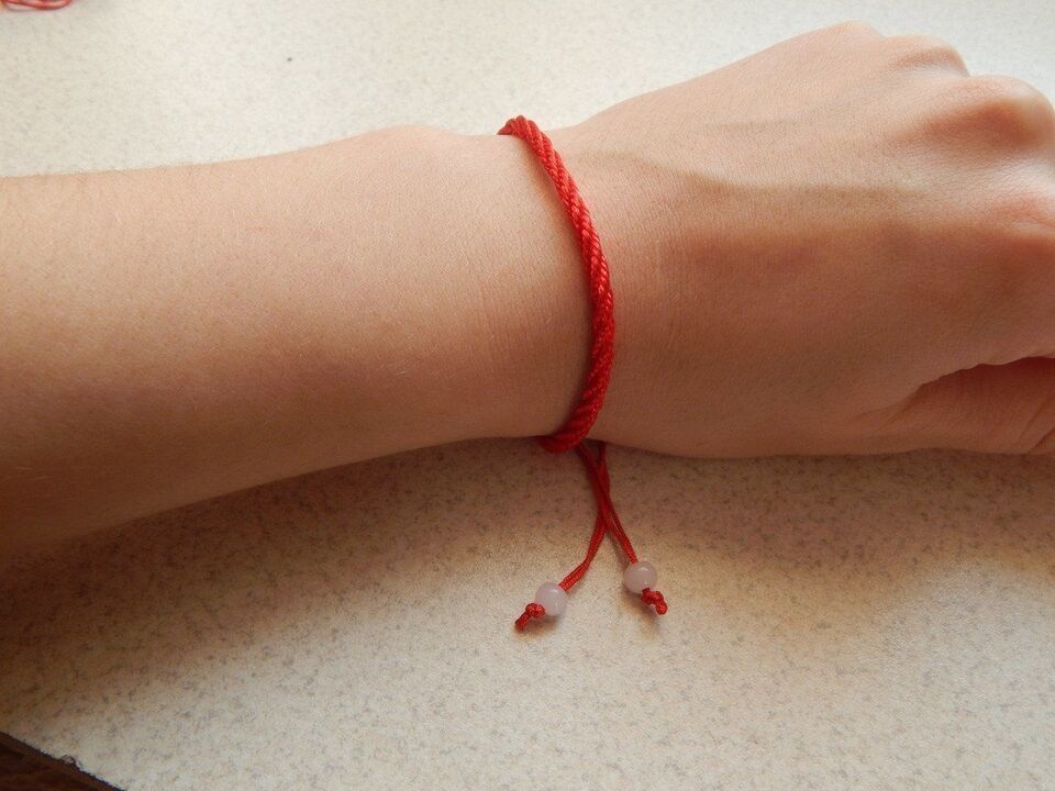 red thread on the wrist